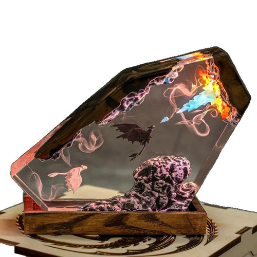 Three-quarter view of the resin dragon lamp on a white background showing the wedge shape and wood tray base