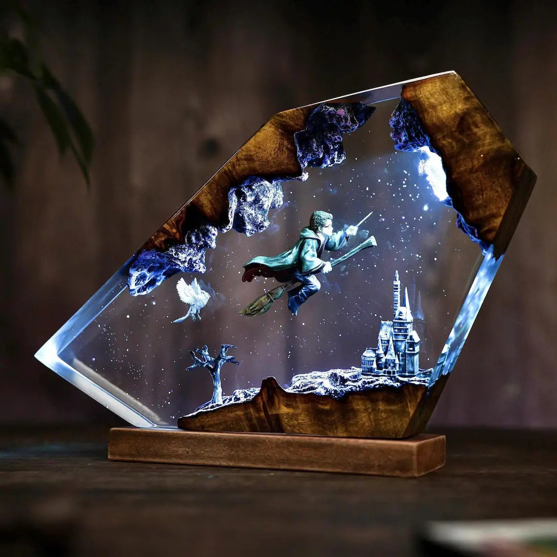 Broomstick Flight resin lamp on a solid wood base