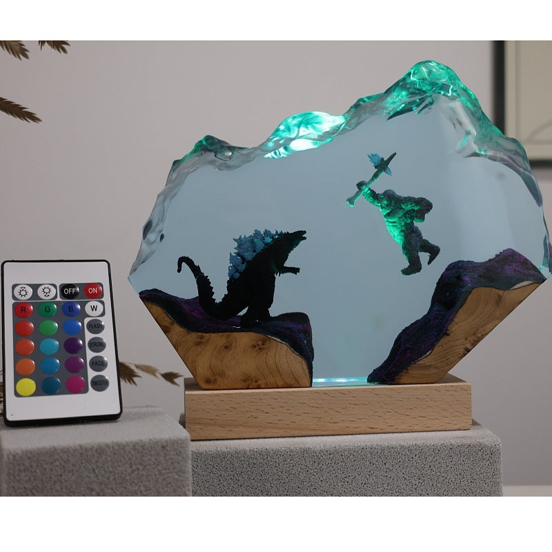 Titan Clash Resin Lamp lit on a wood base