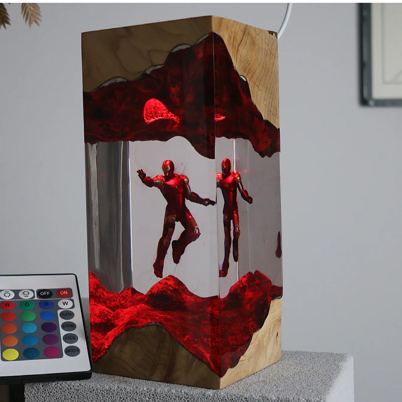 Heroes Tower Resin Lamp lit on a wood base