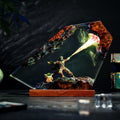The Bounty Hunter Resin Lamp lit on a wood base