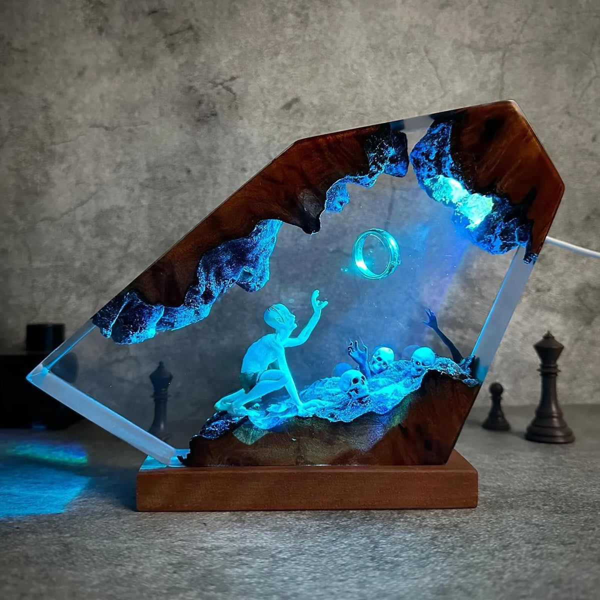 The Lost One resin lamp on a solid wood base