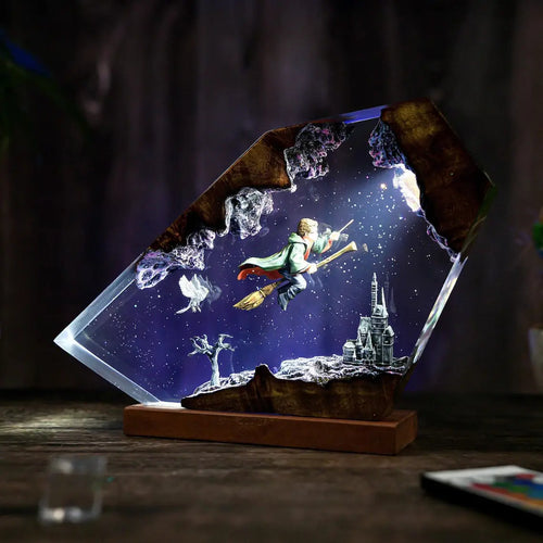 Broomstick Flight resin lamp, angled view